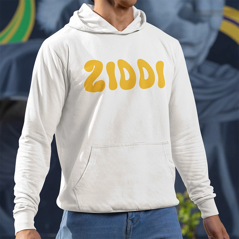 A man wearing a white Ziddi branded hoodie