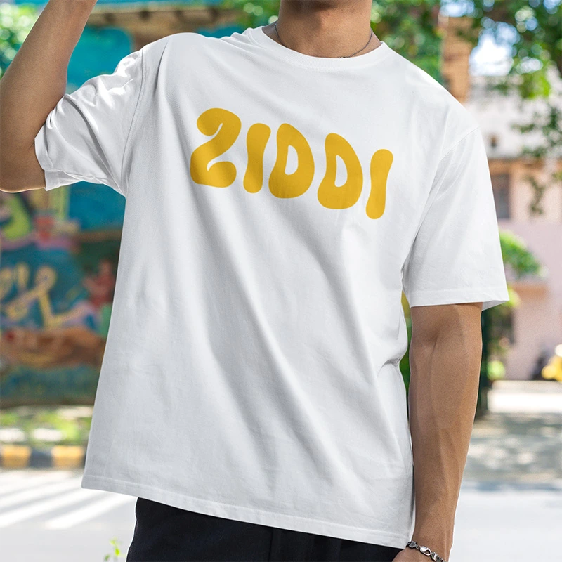 A man wearing a white Ziddi branded tshirt