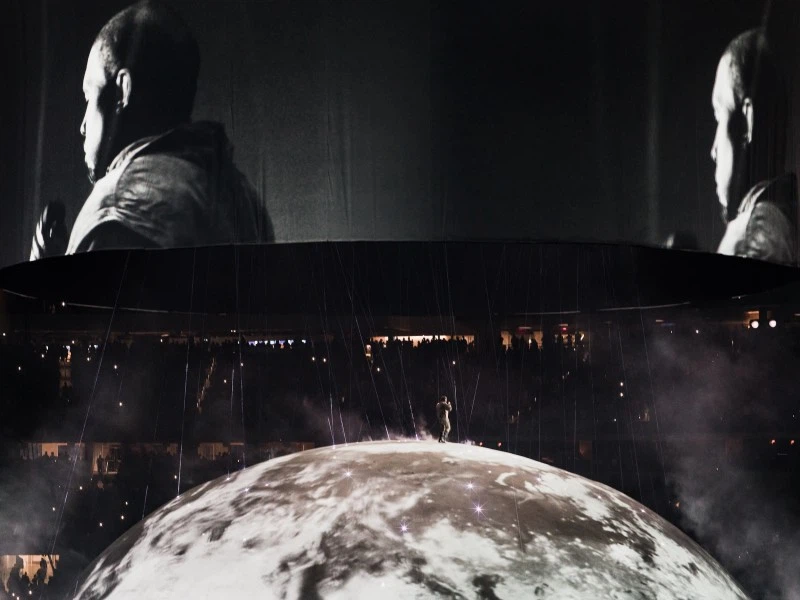 A promotional poster for Ye, popularly known as Kanye West performing live on the iconic bully stage design.